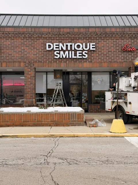 Dentique Smiles — Storefront Sign