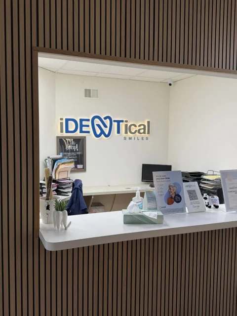 iDENtical Smiles — Reception Logo